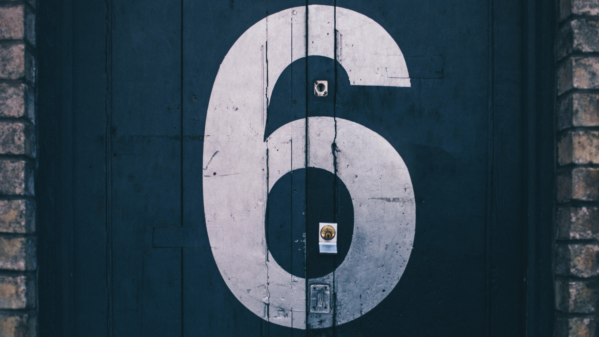 number six painted on a door (Clem Onojeghuo unsplash.com)
