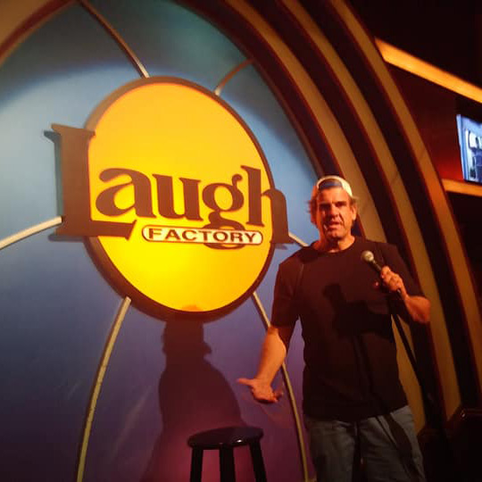 Eric on stage at the Laugh Factory