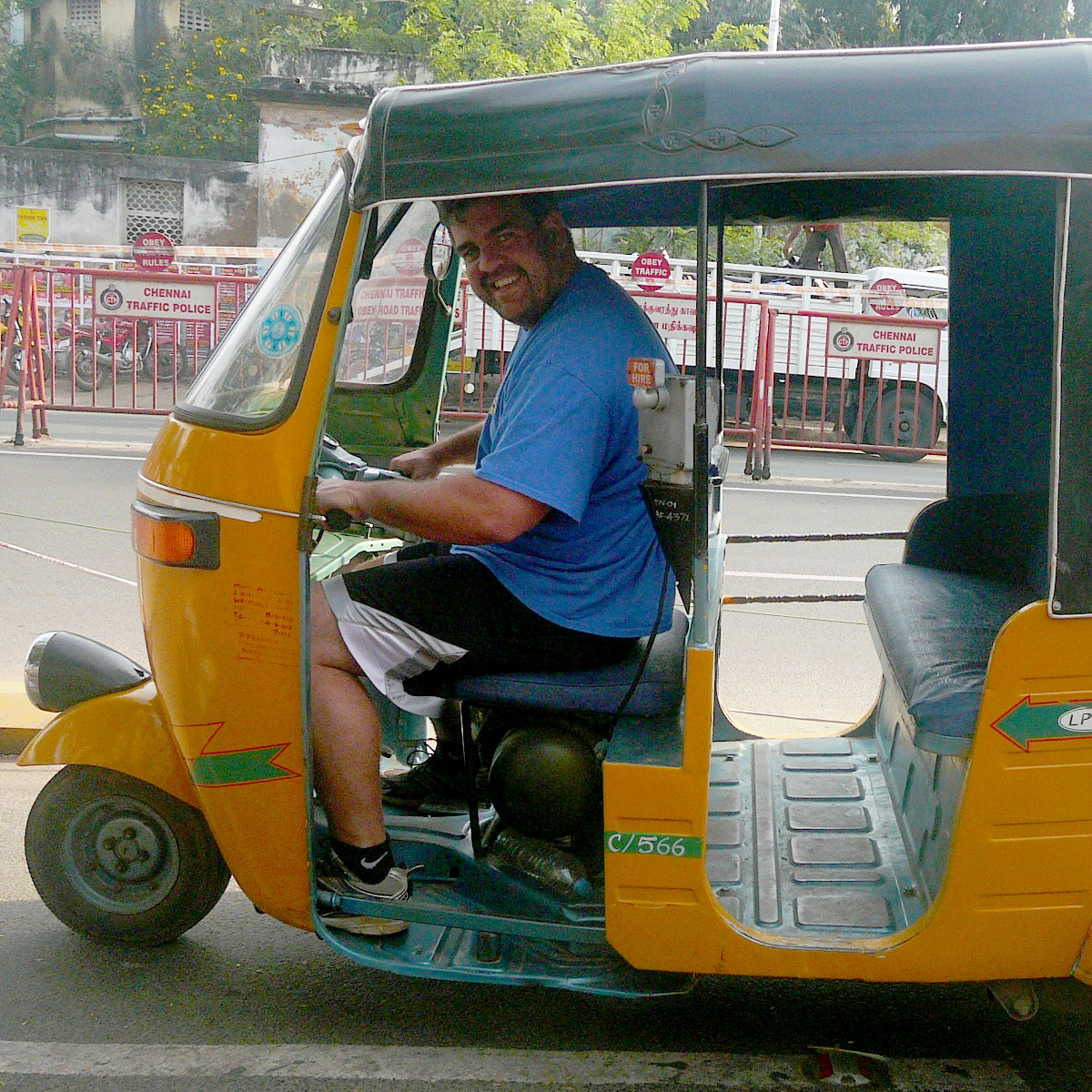 Eric driving a scooter taxi